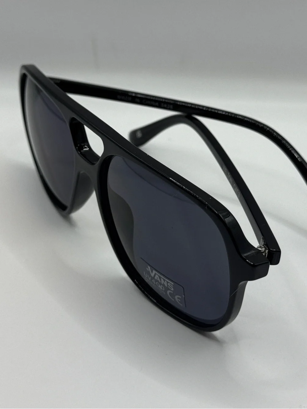 Vans Glossy Black Sunglasses with Blue-Tinted Lenses